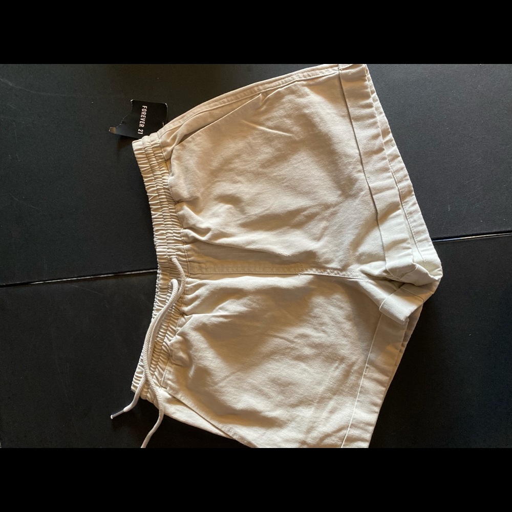 Cream colored shorts.